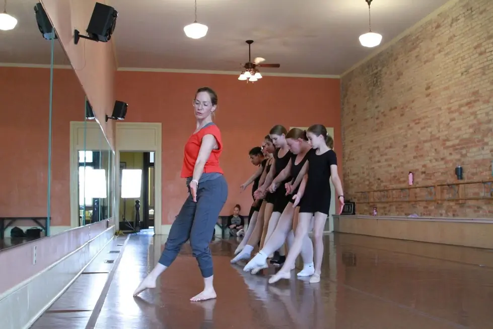 A class at the ballet barre in the brick and terracotta studio